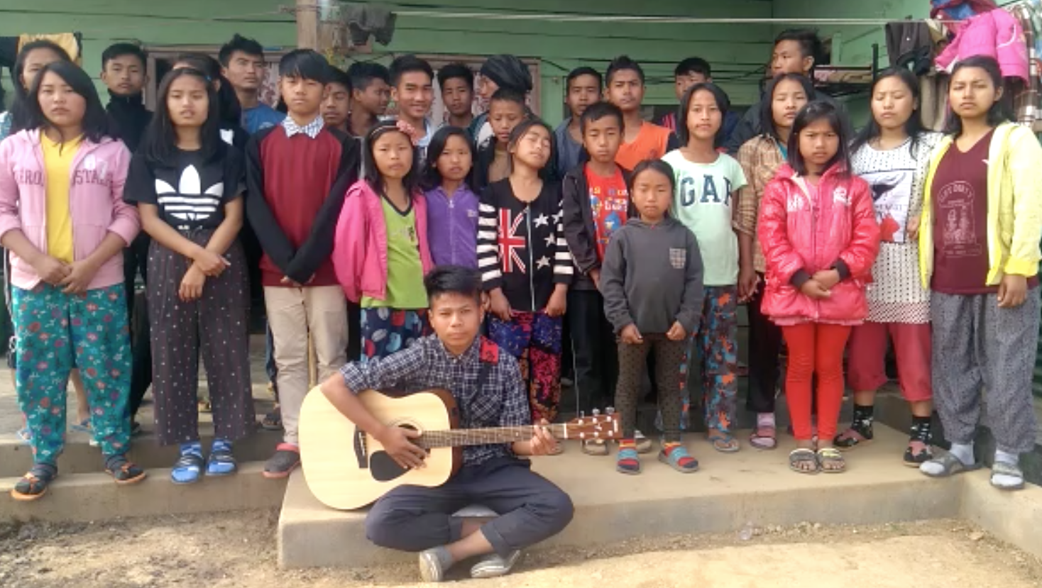 kids from India receive guitar from Hear The Hope