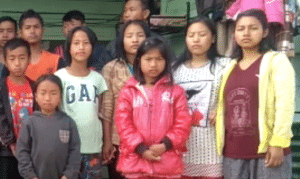 Children in India receive a guitar